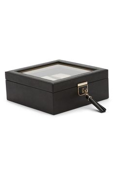 For the avid watch collector, this sophisticated leather-wrapped box holds up to six timepieces displayed under a large window on the cover. The cushions secure themselves with golden knobs that slide into notches in the compartments, while a lock and key help keep your valuable pieces safe and secure. Includes six compartments, six cushions and a key Top flap closure with lock-and-key clasp Leather/textile/metal Imported Modern Rectangular Watch Case For Formal Occasions, Modern Rectangular Case Watch Accessories For Formal Events, Modern Rectangular Case Watch Accessories For Formal Occasions, Modern Rectangular Watch Accessories For Formal Occasions, Modern Formal Watch Accessories With Case, Elegant Black Watch Accessories With Box, Large Window, Lock And Key, Watch Box