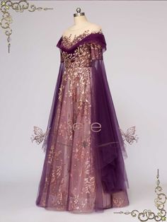 an evening gown on display in front of a white background with gold and purple accents