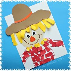 a paper cut out of a scarecrow wearing a hat