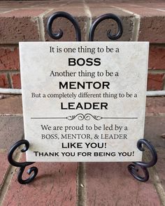 a sign that says it is one thing to be a boss and another thing to be a mentor leader