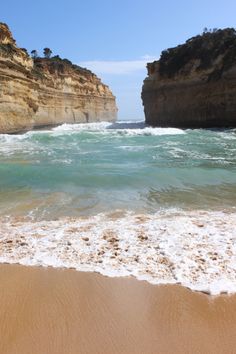 the beach has waves coming in to shore