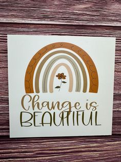 a card that says change is beautiful with a rainbow in the middle and a clover on it