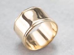 This vintage yellow gold band is absolutely stunning! Also called a cigar band, this ring has a high polish and beautiful shine. The yellow gold has a rich warmth to it that makes the ring all the more eye-catching. Metal: 14K Yellow Gold Width of Band: 12.1 mm Height off Finger: 1.0 mm Ring Size: 6.25 Marks: "14K" Stamped on the inside band Vintage Yellow, Gold Band, Eternity Bands, Cigars, Gold Bands, Wedding Band, Wedding Bands, Ring Size, Wedding Rings