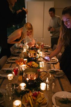 a group of people sitting around a dinner table