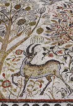 the mosaic work on the floor shows an animal and tree