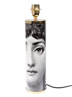 a lamp with a photo of a woman's face on it