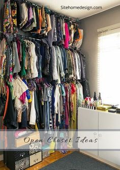 an organized closet with clothes hanging on the wall and a rug in front of it