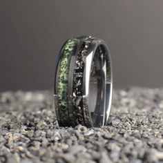 Introducing our extraordinary Meteorite and Moss Agate Wedding Ring, a perfect blend of celestial beauty and earthly elegance. Crafted from ultra-durable silver tungsten, this ring is designed with two equal channels, each filled with a unique inlay. One channel features genuine meteorite, showcasing the timeless allure of the cosmos, while the other is adorned with moss agate, capturing the serene beauty of nature. This 8mm ring is not only visually stunning but also extremely scratch-resistant Wedding Agate Rings With Polished Finish, Moss Agate Wedding Ring, Agate Wedding Ring, Meteorite Wedding Band, Agate Wedding, Antler Ring, Black Tungsten Rings, Tungsten Wedding Band, Meteorite Ring