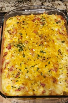 a casserole dish with cheese and other toppings