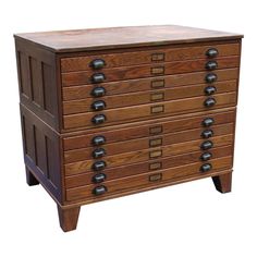 a wooden dresser with many drawers and knobs