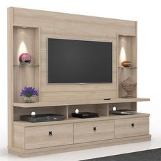 an entertainment center with a flat screen tv mounted on it's side and drawers