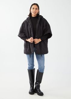 Step out in timeless elegance with our Black Diamond Quilted Poncho. This sophisticated piece features an adjustable drawstring at the waist for a more tailored fit, elbow-length sleeves for a chic silhouette, and a closed hood that adds a touch of mystery. Black Quilted Nylon Adjustable Drawstring Waist Elbow-length Sleeves Hand wash cold, hang dry. Back Length: 30" Model is wearing size XS-S-M. Winter Outerwear With Drawstring And Relaxed Fit, Winter Relaxed Fit Outerwear With Drawstring, Relaxed Fit Winter Outerwear With Drawstring, Winter Relaxed Fit Drawstring Outerwear, Black Winter Outerwear With Drawstring, Black Drawstring Winter Outerwear, Black Drawstring Outerwear For Winter, Winter Workwear Outerwear With Drawstring, Quilted Poncho