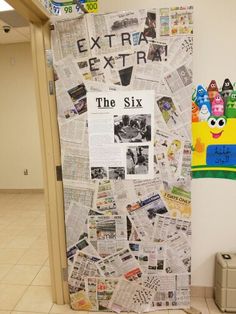 a bulletin board is covered in newspaper paper and has the words extra extra written on it