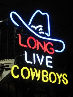 a neon sign that says long live cowboys