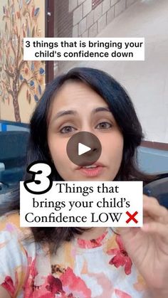 a woman holding up a sign that says 3 things that brings your child's confidence low