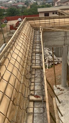 an unfinished building with metal grates on the floor