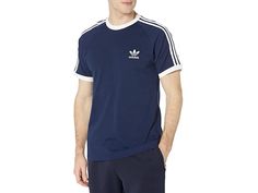 adidas Originals 3-Stripes Tee - Men's T Shirt : Night Indigo 1 : It's like a baseball tee, but cooler! Regular fit is eased, but not sloppy, and perfect for any activity. Crew neckline. Short raglan sleeves. Iconic three-stripes down sleeves and a Trefoil logo at left chest. Straight hemline. 100% cotton. Machine wash, tumble dry. Imported. Measurements: Length: 29 in Chest Measurement: 18 in Sleeve Length: 16 in Product measurements were taken using size LG. Please note that measurements may v Cotton College Baseball Jersey With Three Stripes, Casual Raglan Sleeve T-shirt For Sports, Cotton Baseball Jersey With Three Stripes, Casual White Baseball Jersey With Contrast Stripes, Casual Three Stripes T-shirt For Sports Events, Varsity Tops With Three Stripes For Baseball Season, Casual College Baseball Jersey With Three Stripes, Casual Baseball Jersey With Three Stripes For Streetwear, Casual Streetwear Baseball Jersey With Three Stripes