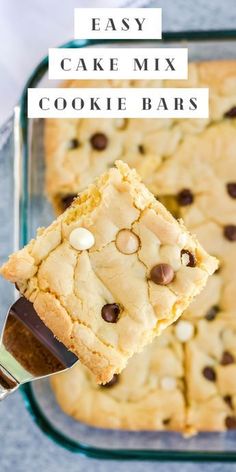 easy cake mix cookie bars in a glass baking dish with a spatula being held up