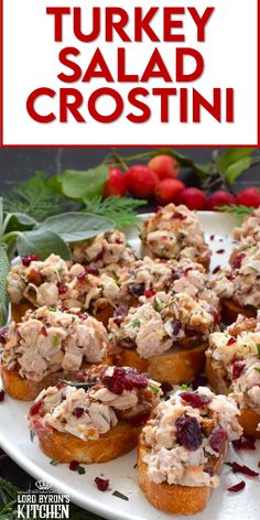 turkey salad crostini on a white platter