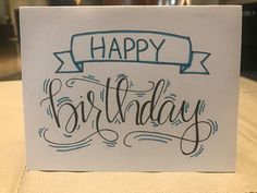 a birthday card with the words happy birthday written in cursive writing on it