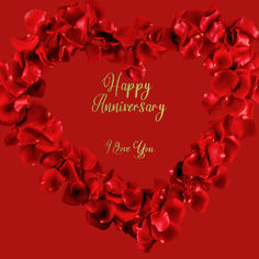 a heart shaped frame with red flowers and the words happy anniversary on it