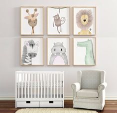 a baby's room with four framed pictures on the wall