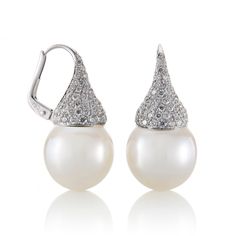 Mastoloni's elegant South Sea cultured pearl kiss earrings are accented with pavé white diamonds for a touch of shimmer. Founded in the mid-1920s by Frank Mastoloni, Sr., the family-owned business has grown to become one of the most respected in the cultured pearl industry. The company is renowned for its meticulous designs, superior craftsmanship and unparalleled quality. White South Sea cultured pearls, 13.5mm. Diamonds, 2.00ctw. 18-karat white gold. Pierced only. Formal Pear-shaped Bridal Earrings With Brilliant Cut, Formal Bridal Earrings With Brilliant Pear Cut, Pear Shaped Brilliant Cut Bridal Earrings For Formal Occasions, Pear-shaped Bridal Earrings With Brilliant Cut For Formal Occasions, Luxury Pear-shaped Bridal Earrings For Formal Occasions, Luxury Wedding Pearl Earrings With Diamond Accents, Luxury Pearl Earrings With Diamond Accents For Wedding, Luxury Diamond Pearl Earrings With Pave Setting, Elegant Pearl Earrings For Wedding