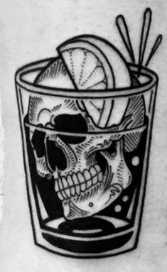 a black and white photo of a skull in a glass with lemons on it