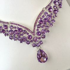 Purple is a favorite wedding color, and it can go well for Spring as well as Winter events. In line with the latest wedding trends, this beautiful three-piece bridal jewelry set is adorned with intricately faceted purple rhinestone crystals that capture the light from every angle with a perfectly translucent appeal. All pieces are rhodium plated for a flawless finish which enhances the intricate detailing and conveys a modern take on old elegance. Necklace: 17" (approx. 43cm) long with a 2" (app Gold Necklace And Earrings Set, Wedding Jewelry And Accessories, Crystal Bridal Jewelry Sets, Silver Tiara, Winter Event, Bridal Jewelry Set, Wedding Accessories Jewelry, Purple Rhinestone, Purple Crystal