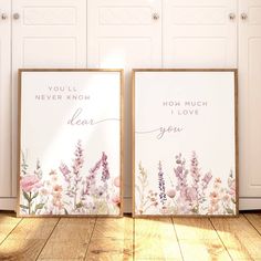 two framed pictures with flowers on them sitting in front of white cupboards and doors