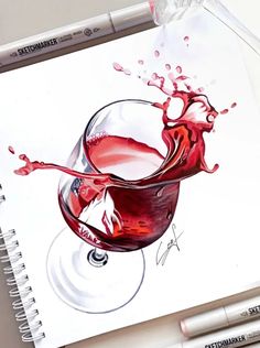 a drawing of a glass of red wine with splashing liquid on it and two markers next to it