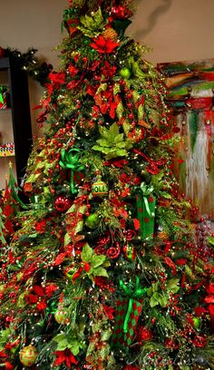 a decorated christmas tree with red and green decorations