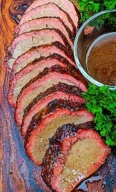 sliced steak with sauce and parsley on the side, ready to be served for dinner