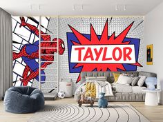 a bedroom with a spiderman wall mural on the wall and a couch in front of it