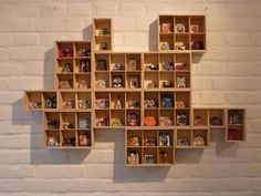 a wooden shelf filled with lots of different types of items on top of each other