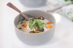 a bowl of soup with carrots, celery and other vegetables in it