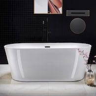 a white bath tub sitting on top of a tiled floor