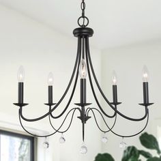 Incorporate a modern sense into your living space with this uniquely Matte Black with Branch Candlestick Black Modern/Contemporary Chandelier Light by Uofin Lighting, safely rated for dry locations. The 6-Light farmhouse chandelier from artistic flair is introduced to minimalism. Each open silhouette makes a sculptural statement, all with an added texture of a rustic finish as well as looped accents. A bucolic motif blends with traditional design in all structures for a versatile aesthetic. The Black Farmhouse Chandelier Lowe's, Farmhouse Candlestick Chandelier, Black Farmhouse Chandelier The Home Depot, Chandelier Over Tub Black, Black Chandelier Farmhouse Dining Room, Uolfin Chandelier, Black Chandelier Above Bed, Lowes Black Chandelier, Amazon Black Chandelier