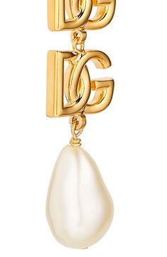 Bring Dolce&Gabbana's signature glamour to any look with these clip-on earrings flaunting goldtone logos and lustrous baroque imitation pearls. Clip-on style Nickel-free Hypoallergenic Goldtone plate/acrylic imitation pearl Made in Italy Elegant Dangle Jewelry With Logo Charm, Luxury Gold-tone Earrings With Logo Plaque, Luxury Gold Clip-on Earrings With Logo, Luxury Gold Earrings With Logo Charm, Elegant Gold Earrings With Logo Charm, Luxury Gold-tone Clip-on Jewelry, Elegant Yellow Gold Earrings With Gold-tone Logo, Clip On Earrings, Dolce And Gabbana