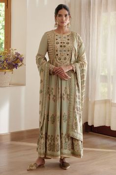 Neutral green long flared anarkali with hand block floral and chevron printed motifs and zardozi embroidered yoke. Comes with trouser and dupatta.
Component: 3
Pattern: Hand Block Prints, Embroidery
Type Of Work: Floral and Geometric Motifs, Zardozi Work
Neckline: Round
Sleeve Type: Long
Fabric: Chinnon, Cotton Satin
Color: Green
Other Details: 
Tassel edged dupatta
Front, back yoke and sleeve hem embroidered
Note: The belt worn by the model is not for sale
Occasion: Mehendi and Haldi - Aza Fash Archana Jaju, Kalamkari Kurta, Celebrity Closet, Organic Colors, Pearl And Lace, Satin Color, Kurta Set, Indian Design, Designer Wear