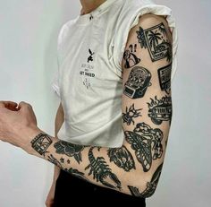 a man with many tattoos on his arm