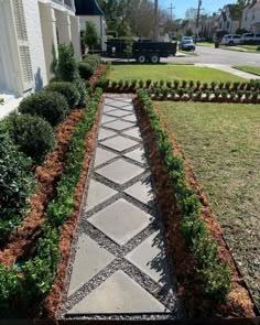 a stone walkway in front of a house