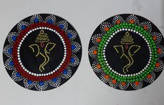 two decorative plates with designs on them