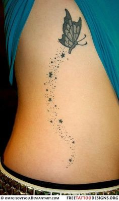 the back of a woman's stomach with stars and a butterfly tattoo on it