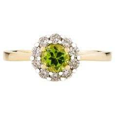 Round Cut Peridot Everyday Ring with Halo of Diamonds in 14K Gold featuring natural peridot of 0.43 carats and diamonds of 0.25 carats. The gorgeous handcrafted ring goes with every style, every occasion or any outfit. Peridot brings delight and good cheer. It attracts love and calms anger by giving renewal to all things. Designed with round cut peridot set in center with halo of diamonds made in solid gold that makes it a perfect fit to wear it on your occasion or style it with any of your basi Elegant Round Cut Peridot Diamond Ring, Green Peridot Jewelry With Halo Setting, Peridot Diamond Ring With Round Cut, Yellow Gold Peridot Diamond Ring, Yellow Peridot Round Ring, Mother Daughter Gifts, Peridot Stone, Gold Gemstone Ring, Blue Sapphire Diamond