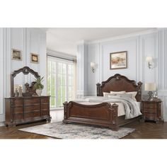 a bedroom scene with focus on the bed and dresser