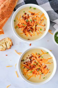 two bowls filled with soup and topped with cheese