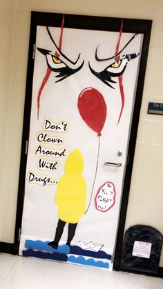 a door decorated with an image of a clown holding a red balloon