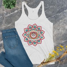 Introducing our vibrant Flower Mandala Tank Top, where spirituality meets style! 🌼👁️ 🌟 Embrace the mystical allure of the All Seeing Eye as it takes center stage on this stunning Mandala tank top. 🌼 Crafted with care, this Meditation Shirt is more than just apparel; it's a statement of your inner journey and a celebration of your unique style. Our Alternative Fashion piece is designed to bring positive vibes into your life, making it perfect for yoga sessions, meditation, or simply as Trippy Bohemian Summer Tops For Meditation, Multicolor Hippie Tops For Festivals, Bohemian Tops With Graphic Print For Festivals, Hippie Graphic Print Festival Tops, Multicolor Graphic Print Top For Festival, Multicolor Graphic Print Top For Music Festival, Artistic Graphic Print Tops For Festivals, Artistic Graphic Print Festival Tops, Bohemian Graphic Print Tops For Music Festival