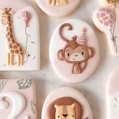 cookies decorated to look like animals, giraffes and zebras with numbers on them